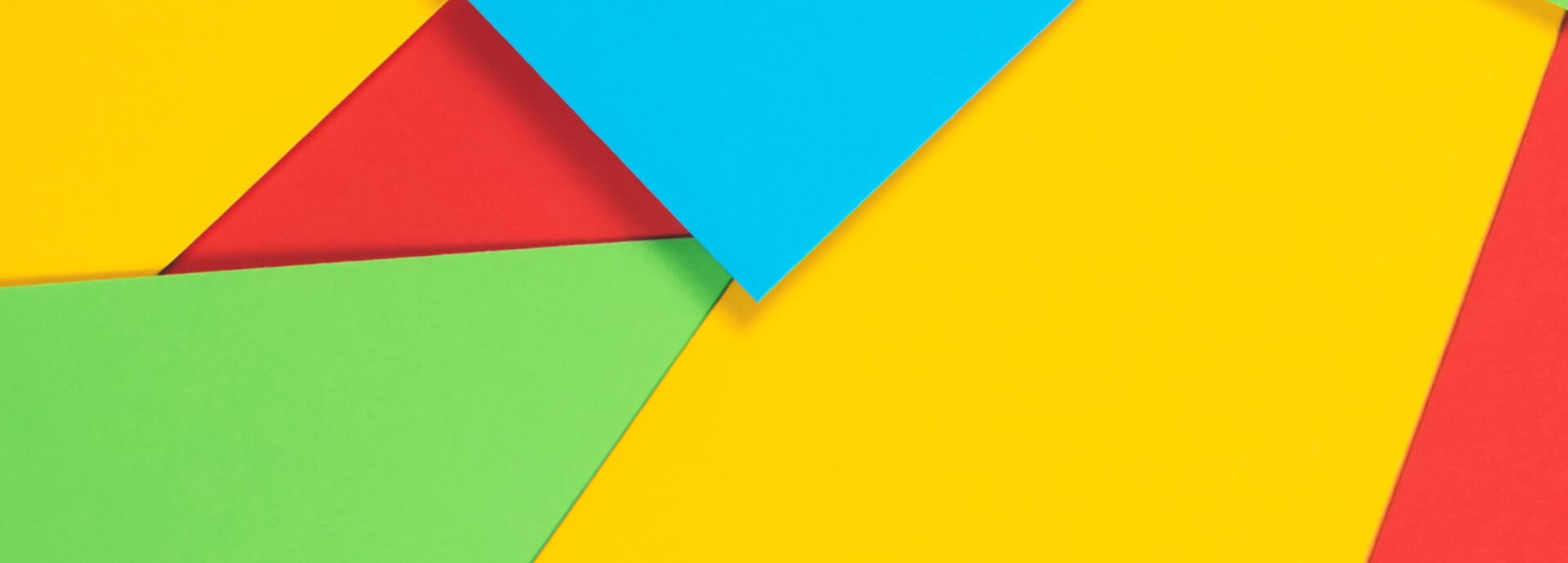 Colorful background made of red, blue, green and yellow paper cards | Google Logo evolution
