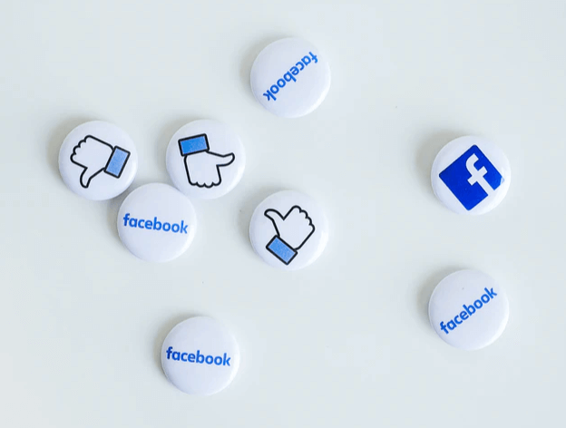 Measure your social media performance | Mini white buttons with Facebook logos and Like icon.