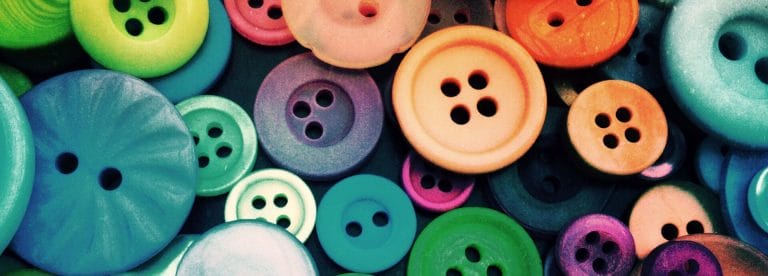 Multicolor buttons laying in a pile | Choose the Right Button Shape