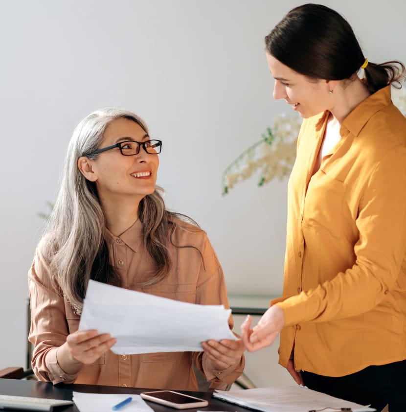 Two people discuss plan for business