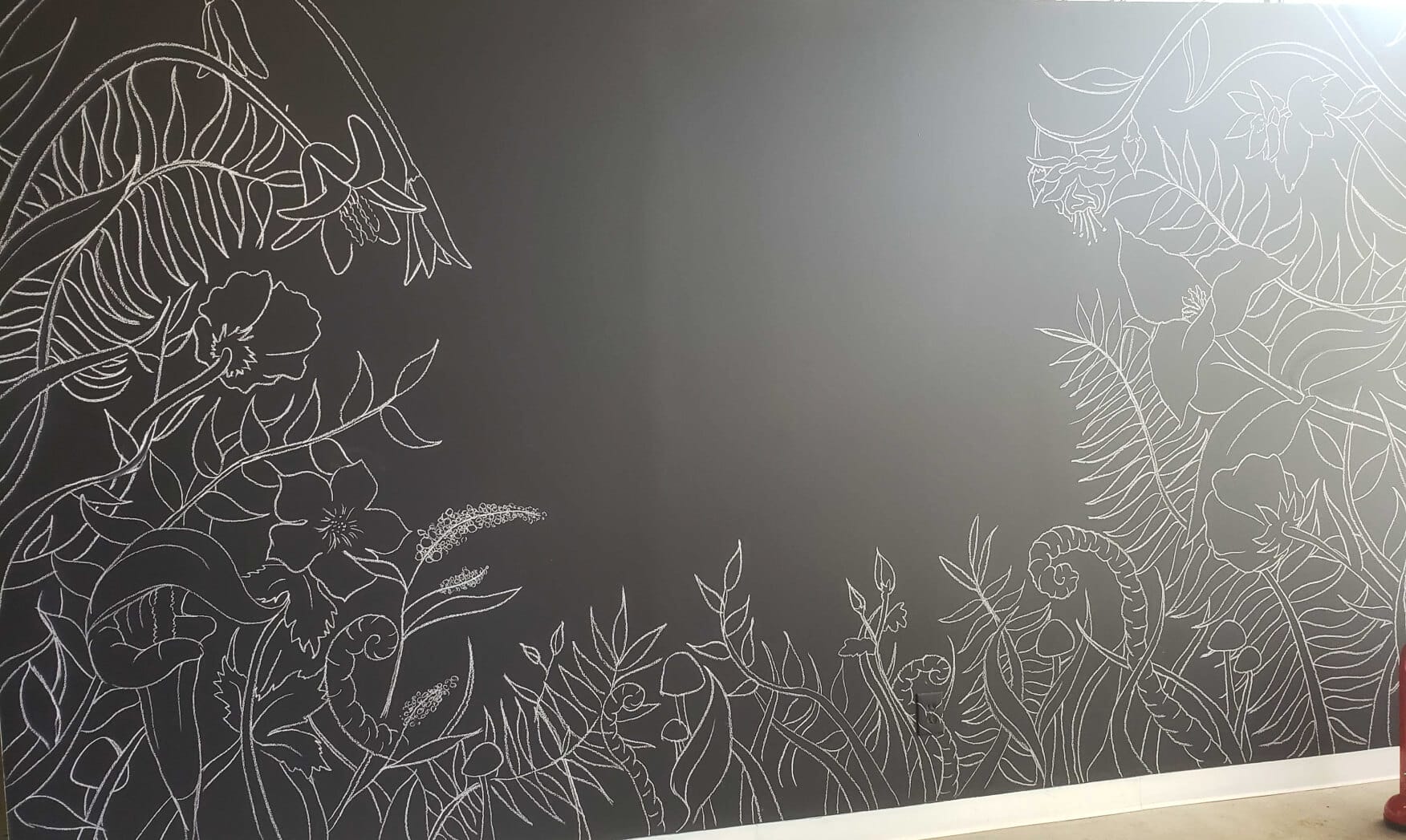 Chalk sketched mural on a black wall in Perfect Afternoon's office space in Pleasant Ridge, Michigan