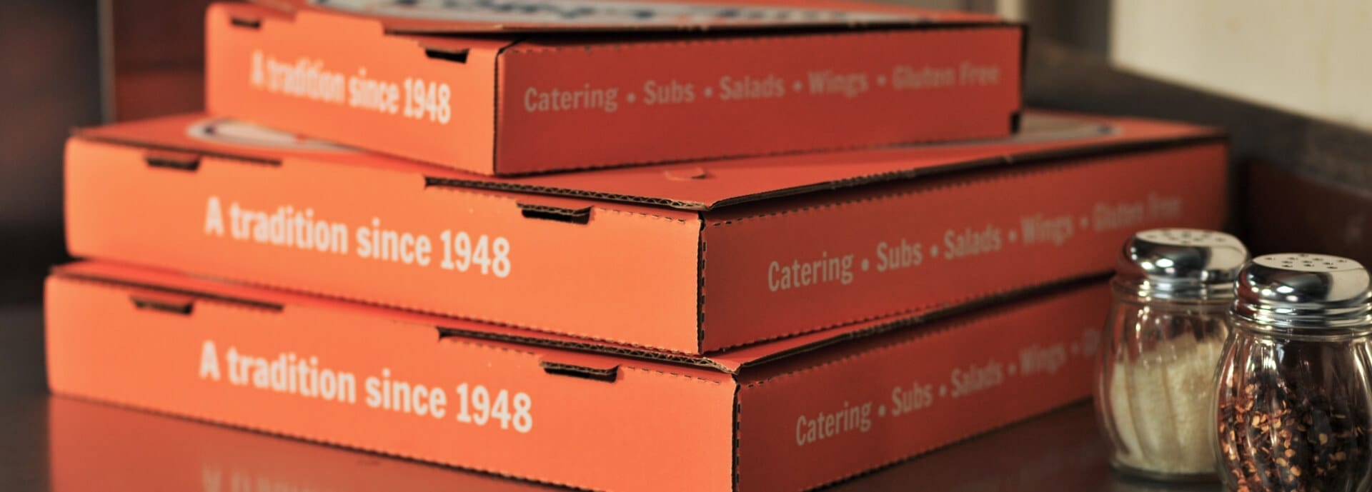 Stacked Pizza boxes from Cottage Inn
